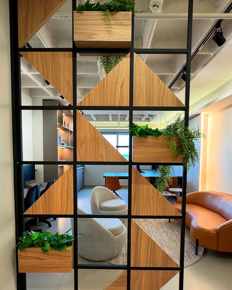 Office carpentry in Dubai — timber and steel room divider with built-in planters